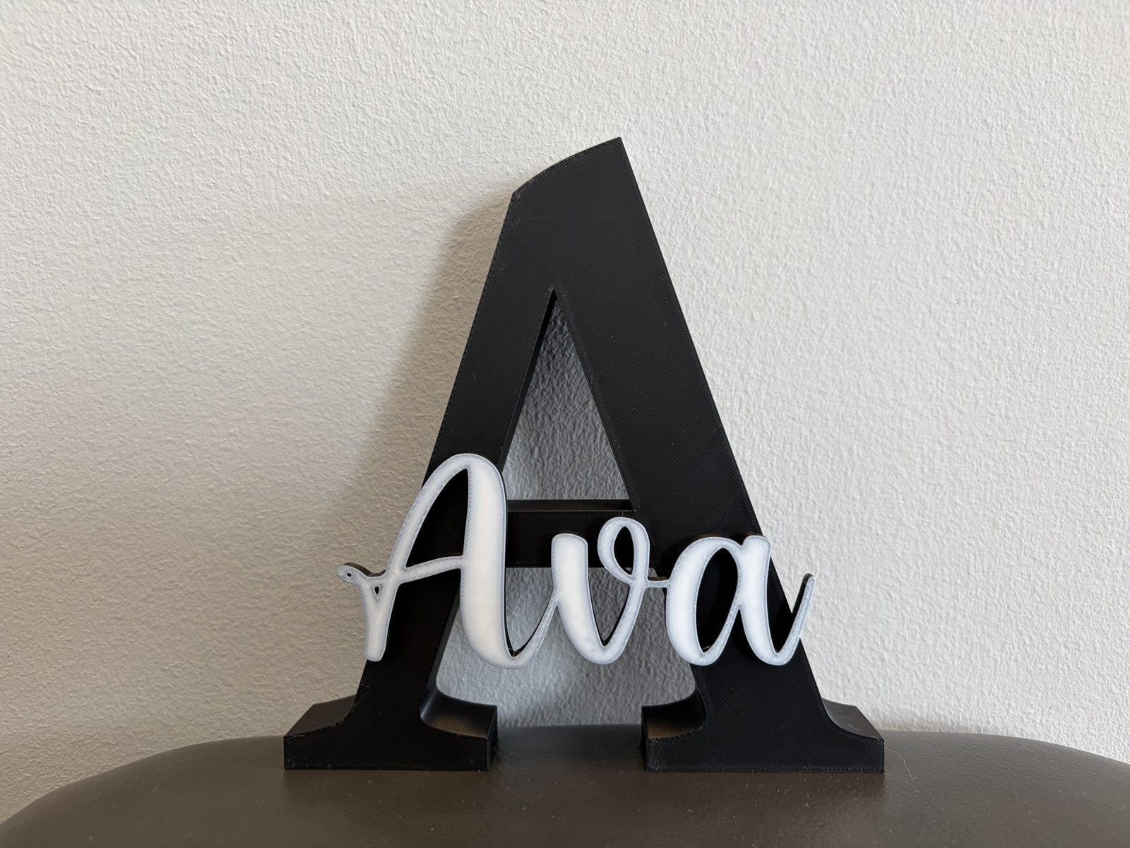 Personalized dual-colour name sign printed in black and white PLA